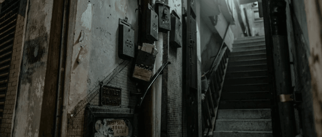 a photo of a dark/dank alleyway/stairwell.