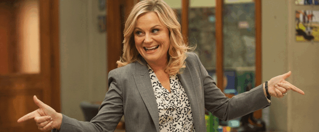 Leslie Knope in Parks & Rec looking like she's giving finger guns.