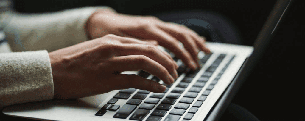 what is satire?

close up photo of hands typing on a laptop keyboard