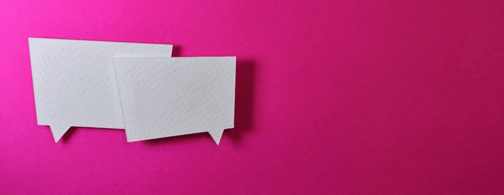 two "speech bubble" cutouts on a pink background