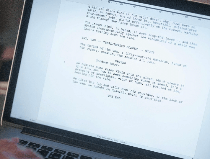 A screenplay on a laptop screen