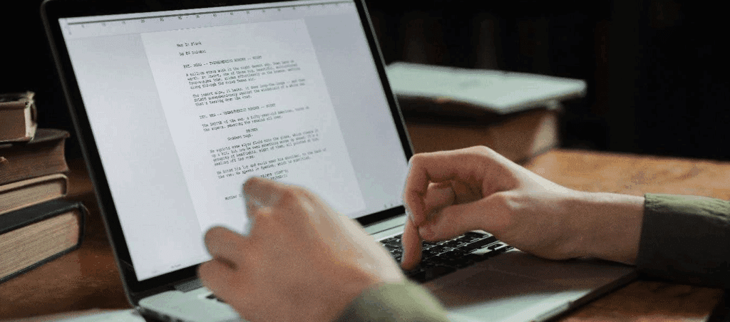 photo of someone working on a script on a laptop