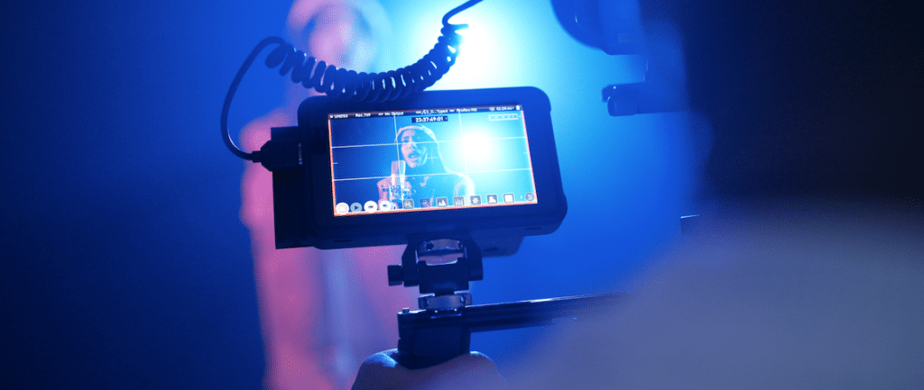 music video script

photo of a camera viewfinder recording a music video on a set with bright lights.